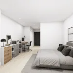 A bedroom featuring a bed with pillows and bedding, a nightstand beside the bed, and a chest of drawers. The room has stylish interior design elements like a vase on the nightstand, cabinetry along one wall, and window treatments.