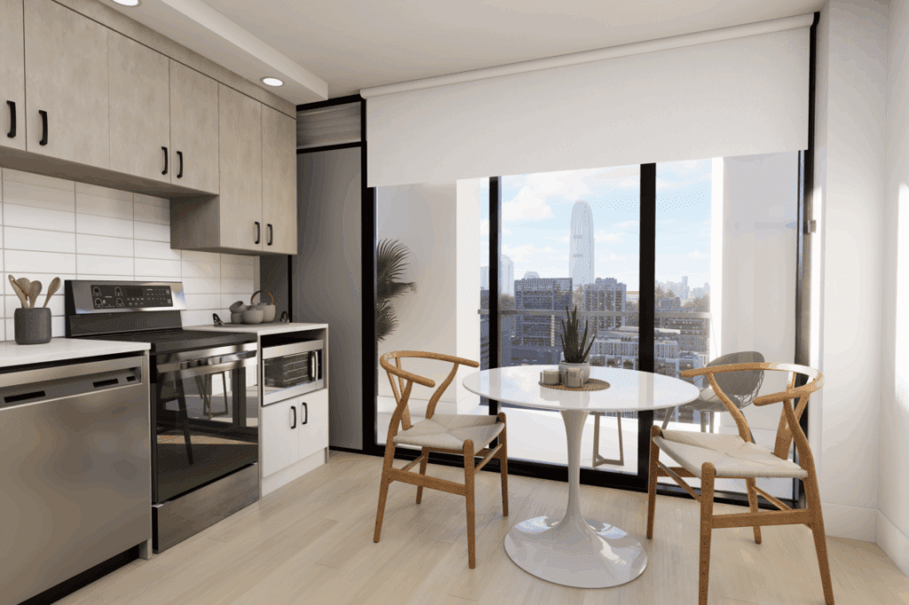 A kitchen featuring a table and chairs, equipped with various home appliances including a sink and oven. The room has cabinetry, countertops, and a floor, all contributing to the overall interior design.