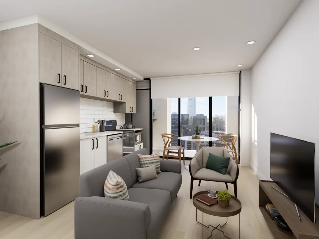A cozy living room featuring a comfortable couch facing a television, with cabinetry and decorative elements adorning the walls. The floor is well-maintained, and the overall ambiance reflects modern interior design.