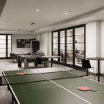 A games room featuring a ping pong table, pool table, and shuffleboard, with lots of tables and seating to play board games or poker.