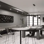 A games room featuring a ping pong table, pool table, and shuffleboard, with lots of tables and seating to play board games or poker