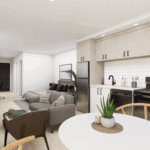 A spacious kitchen and living room area featuring a comfortable couch and a table. The interior design includes cabinetry, a vase on the coffee table, and various home appliances. The floor is well-lit, enhancing the open layout of the apartment.